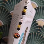 Marque page savane avec perles oranges et noires