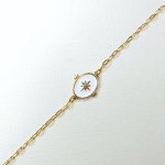 bracelet en acier inoxydable doré avec un pendentif blanc orné d'une étoile