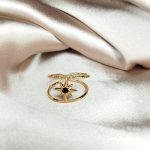 jolie bague en acier inoxydable doré orné d'une étoile et d'un strass son centre